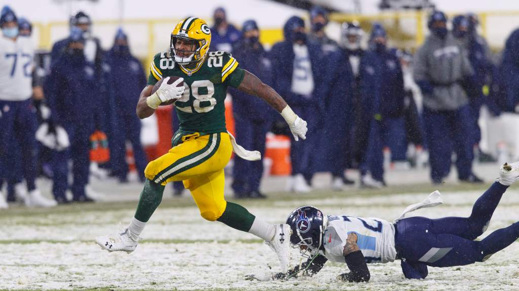 Upcoming Packers AJ Dillon shines in a landslide victory over the Titans