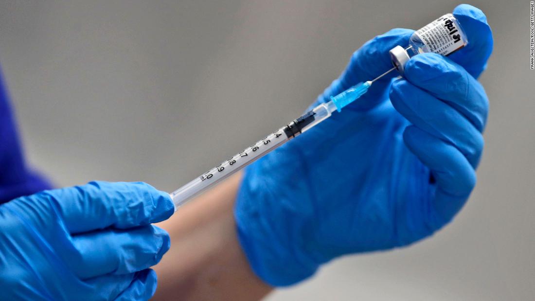 The UK's top medical officials are defending the delay between Covid-19 vaccine doses
